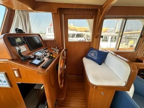 Slide: The Image of Interior of 2009 Marine Trader 36 Euro Sedan with helm and seating area. - 31