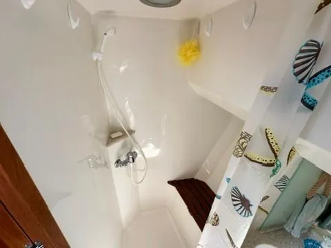 Slide: The Image of Shower area in 2009 Marine Trader 36 Euro Sedan with nautical-themed curtain. - 41