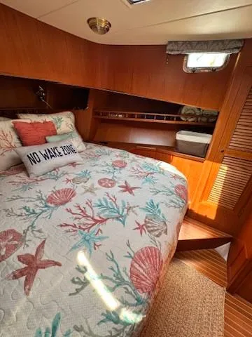 Slide: The Image of Cozy cabin interior of 2009 Marine Trader 36 Euro Sedan with nautical bedding. - 43