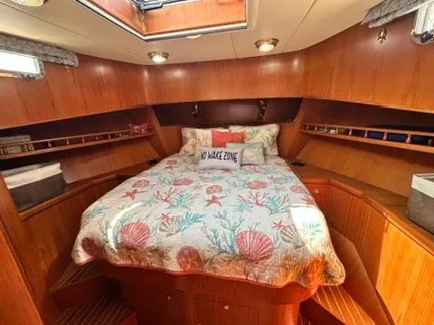 Slide: The Image of Cozy cabin interior of 2009 Marine Trader 36 Euro Sedan with nautical-themed bedding. - 44