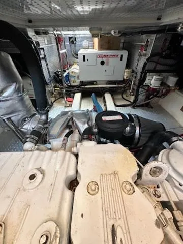 Slide: The Image of Engine room of a 2009 Marine Trader 36 Euro Sedan with visible machinery and components. - 49