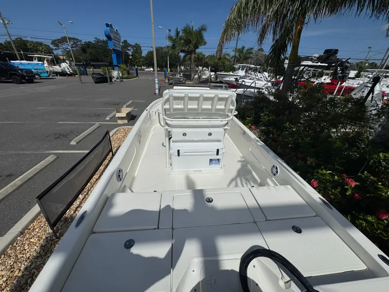 Slide: The Image of 2025 Skeeter SX 230 boat displayed outdoors, showcasing spacious deck and seating. - 12