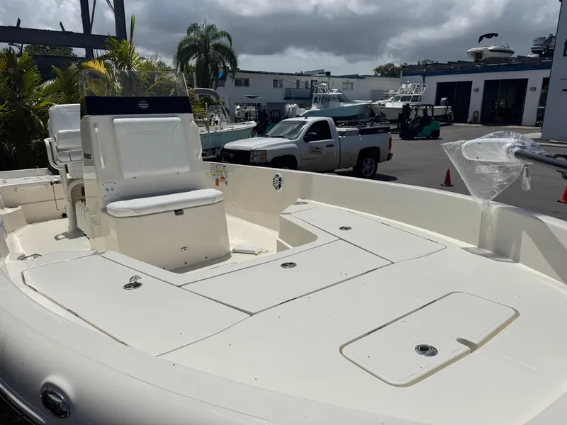 Slide: The Image of 2025 Skeeter SX 2350 boat in marina, featuring spacious deck and seating. - 6