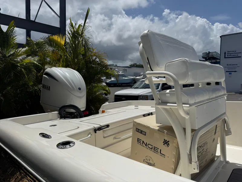 Slide: The Image of 2025 Skeeter SX 2350 boat with Yamaha engine, white seating, and Engel cooler. - 8