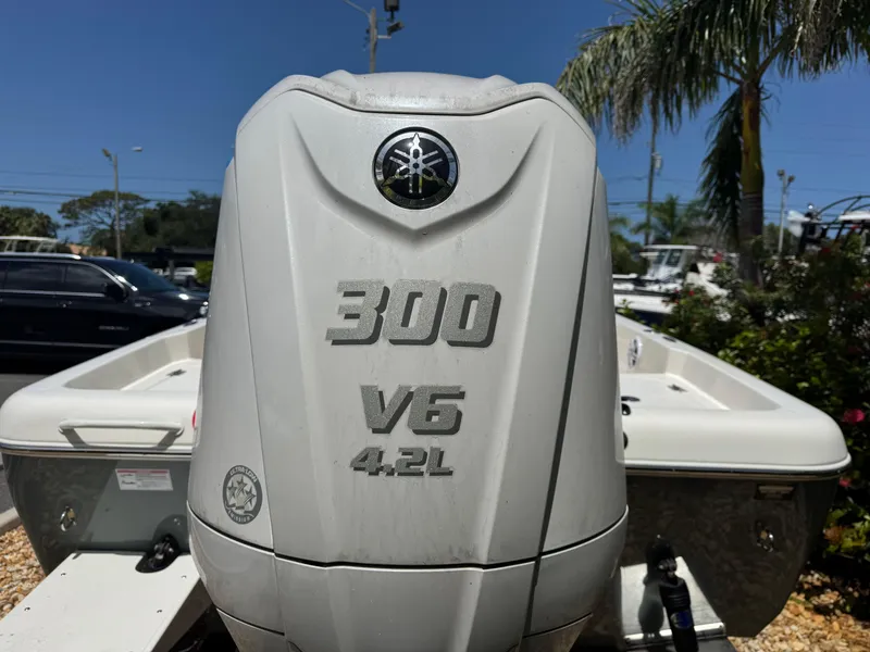 Slide: The Image of 2025 Skeeter SX 2350 boat with Yamaha 300 V6 4.2L engine in sunny setting. - 9