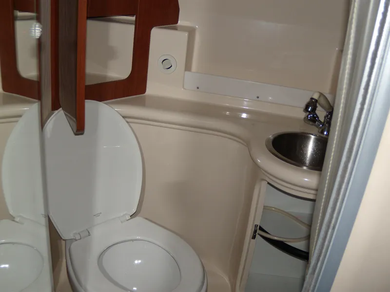 Slide: The Image of 2008 Regal Commodore 2665 boat bathroom with toilet and sink. - 13