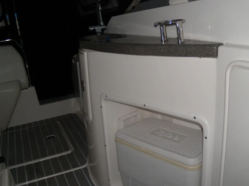 Slide: The Image of 2008 Regal Commodore 2665 boat interior with sink and storage area. - 17