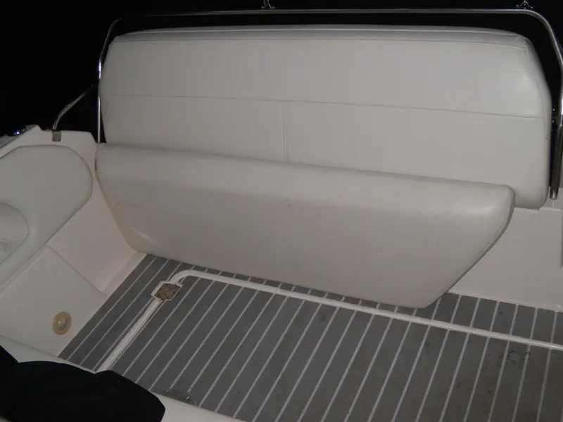 Slide: The Image of 2008 Regal Commodore 2665 boat interior with white seating and striped flooring. - 5