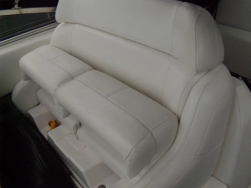 Slide: The Image of White leather seating on 2008 Regal Commodore 2665 boat interior. - 7