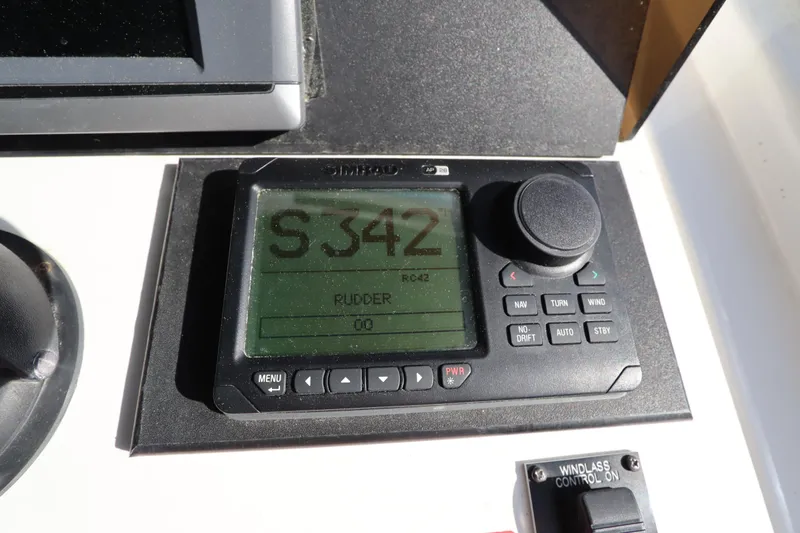 Slide: The Image of Control panel on a 2002 Mainship Pilot 34 boat, displaying navigation settings. - 22