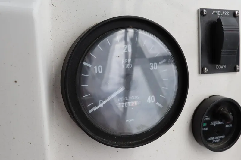 Slide: The Image of Close-up of Mainship Pilot 34 2001 boat gauges and controls. - 23