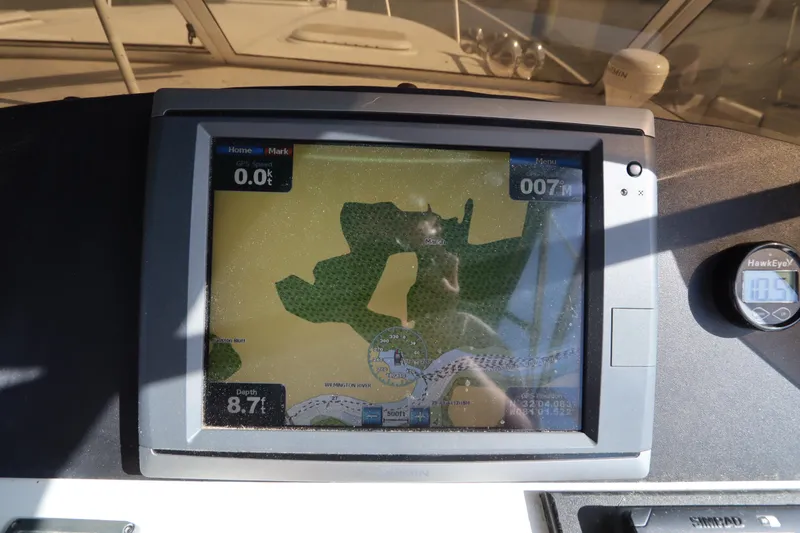 Slide: The Image of GPS navigation screen on a 2002 Mainship Pilot 34 boat dashboard. - 27
