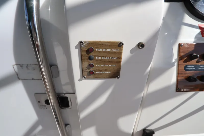 Slide: The Image of Control panel on a 2002 Mainship Pilot 34 boat, featuring bilge pump indicators. - 31