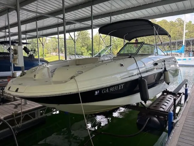 The Image of 2007 Chaparral Sunesta 274 boat docked under a covered marina. - 1