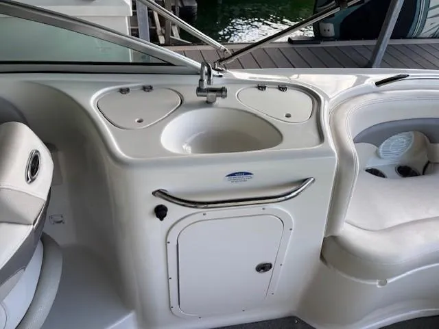 Slide: The Image of 2007 Chaparral Sunesta 274 boat interior with sink and seating area. - 15