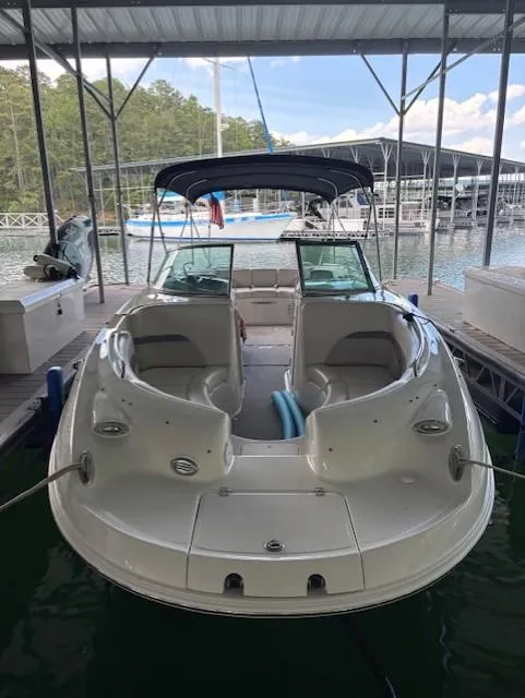 Slide: The Image of 2007 Chaparral Sunesta 274 boat docked under a covered marina. - 4