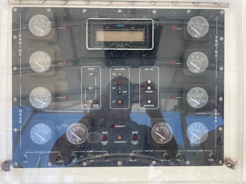 Slide: The Image of Control panel of a 1988 Bertram 43 Convertible boat with gauges and switches. - 16