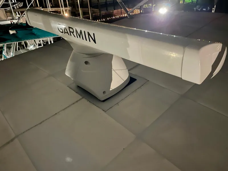 Slide: The Image of Garmin radar on 1988 Bertram 43 Convertible boat, illuminated at night. - 19