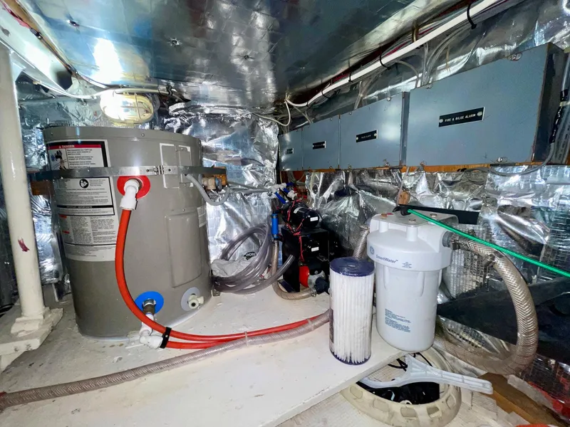 Slide: The Image of Engine room of a 1988 Bertram 43 Convertible with water filtration system and equipment. - 35