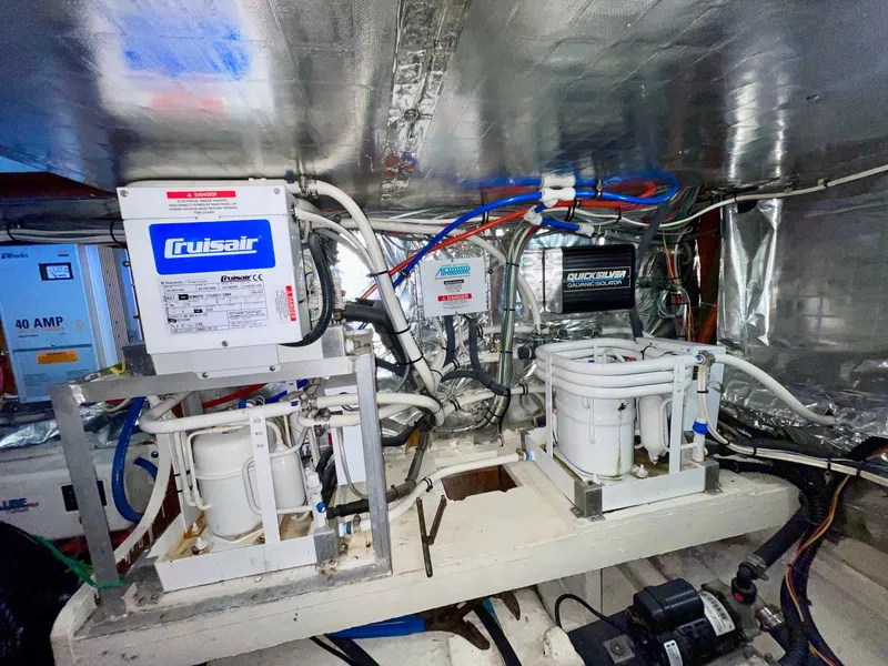 Slide: The Image of Engine room of 1988 Bertram 43 Convertible with Cruisair systems and wiring. - 37