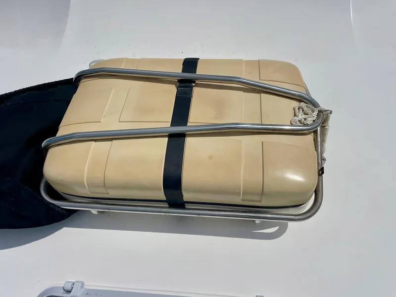 Slide: The Image of Life raft on 1988 Bertram 43 Convertible boat deck, secured with metal frame and strap. - 5