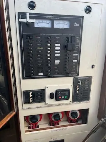 Slide: The Image of Electrical panel of a 1996 Albin 31 Tournament Express boat, featuring gauges and switches. - 48