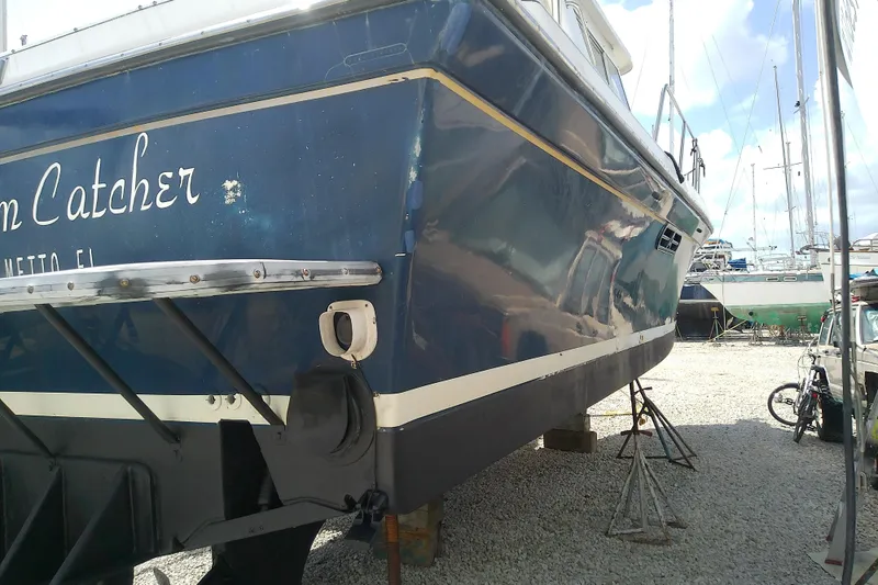 Slide: The Image of 1996 Albin 31 Tournament Express boat on stands in a boatyard. - 70