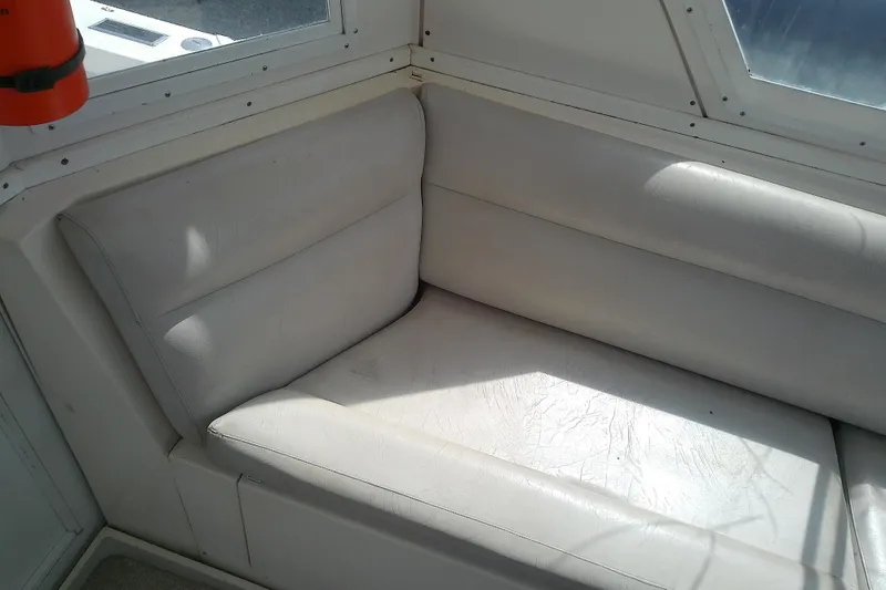Slide: The Image of White leather seating inside a 1996 Albin 31 Tournament Express boat cabin. - 73