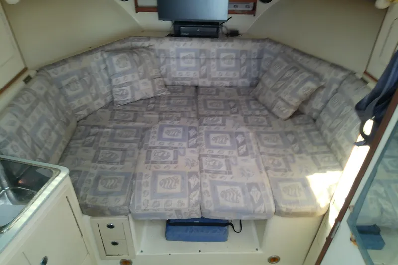 Slide: The Image of Interior of 1996 Albin 31 Tournament Express with patterned cushions and compact sink. - 75