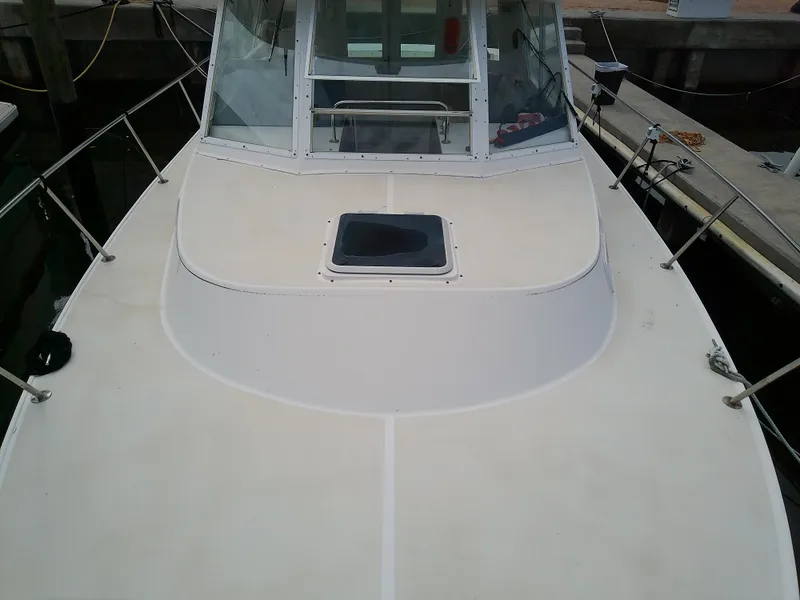 Slide: The Image of 1996 Albin 31 Tournament Express boat deck with hatch, docked at marina. - 8
