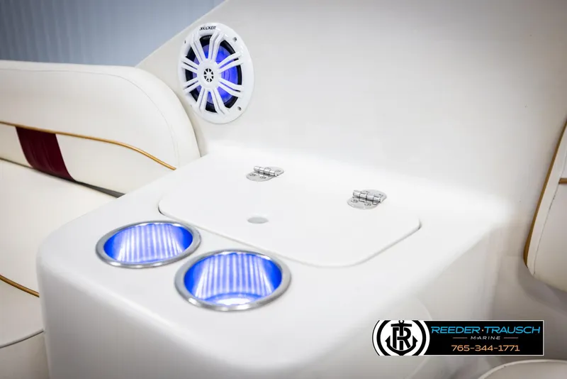 Slide: The Image of 1999 Crownline 242 CR boat interior with illuminated cup holders and speaker. - 20