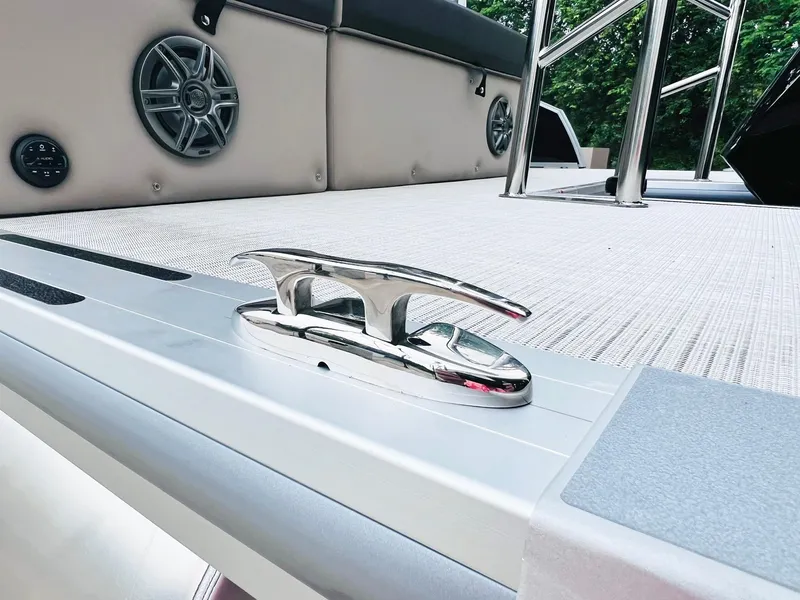 Slide: The Image of 2025 Harris Cruiser 230 boat deck with cleat and speakers. - 11