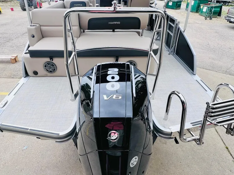 Slide: The Image of 2025 Harris Cruiser 230 boat with powerful 200 V6 engine and spacious seating. - 13