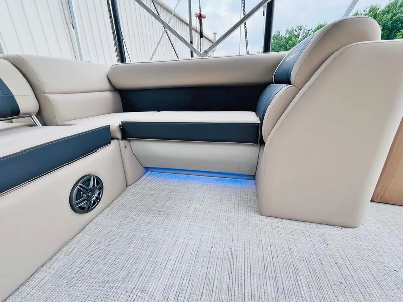 Slide: The Image of Luxurious seating in 2025 Harris Cruiser 230 boat with ambient lighting and speaker system. - 16