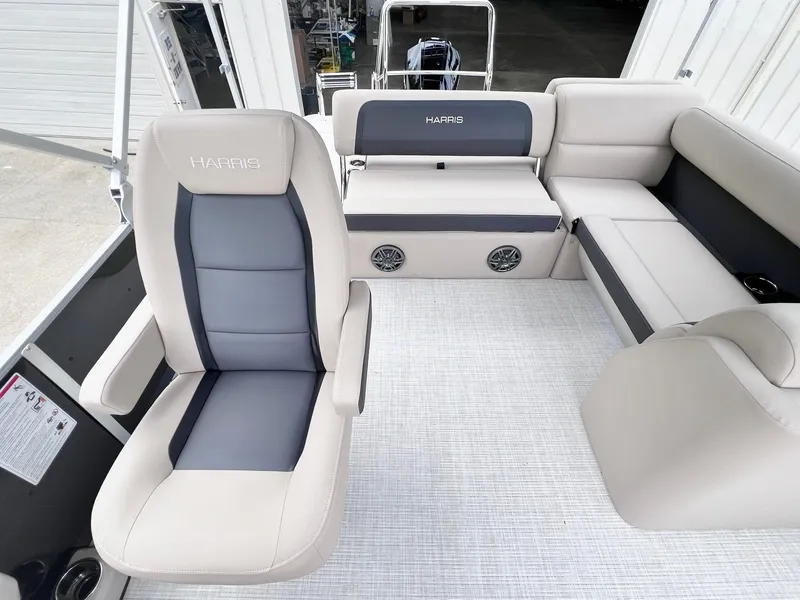 Slide: The Image of 2025 Harris Cruiser 230 interior with plush seating and modern design. - 22