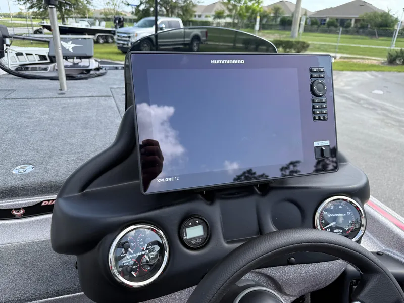 Slide: The Image of Dashboard of 2026 Phoenix 721 ZXL boat with Humminbird Xplore 12 display. - 12