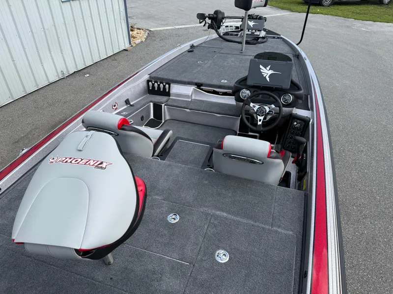Slide: The Image of 2026 Phoenix 721 ZXL boat interior with gray seating and modern dashboard. - 13