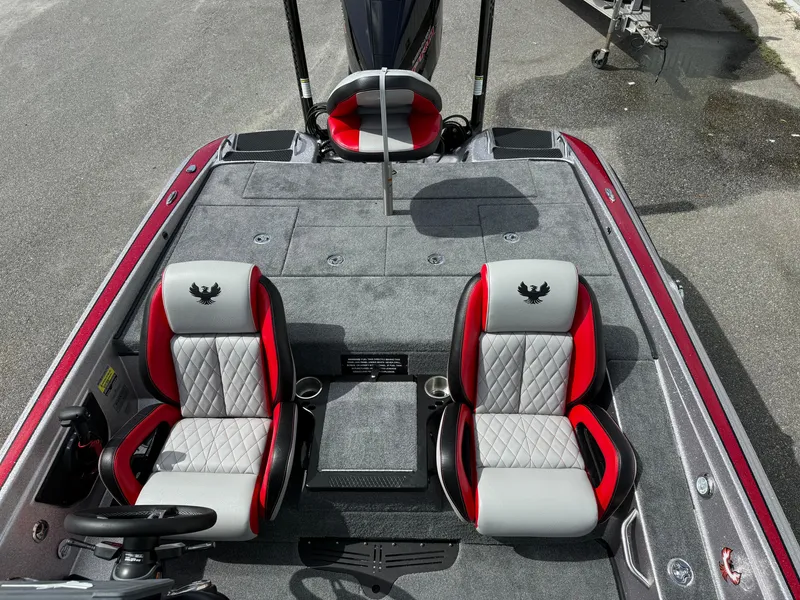 Slide: The Image of 2026 Phoenix 721 ZXL boat interior with red and gray seats, steering wheel, and spacious deck. - 9
