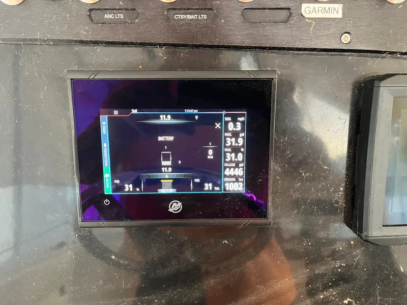 Slide: The Image of Dashboard of a 2020 Wellcraft 222 Fisherman boat displaying battery and system information. - 8