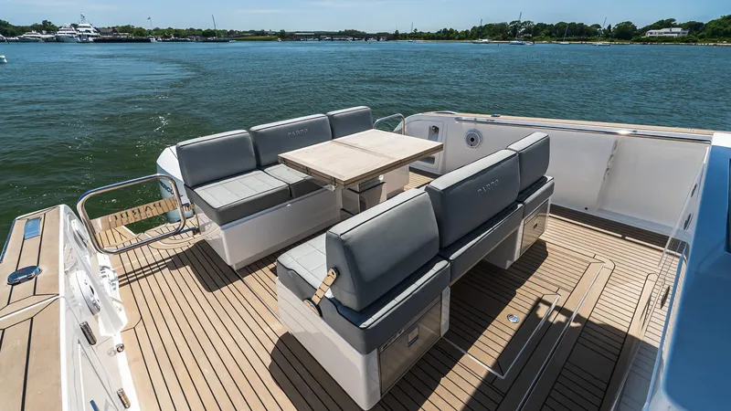 Slide: The Image of 2023 Pardo Yachts P38 deck with seating and table on calm water. - 16