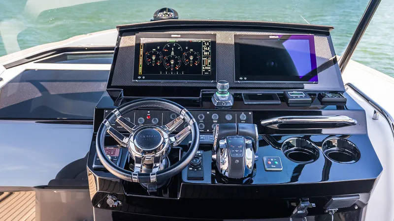 Slide: The Image of Helm of 2023 Pardo Yachts P38 with modern navigation displays and controls. - 23