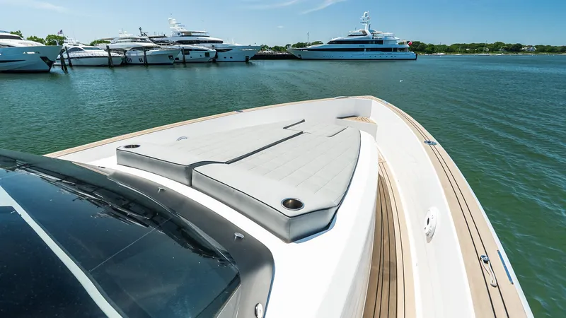 Slide: The Image of 2023 Pardo Yachts P38 luxury yacht docked in a marina with other boats. - 36