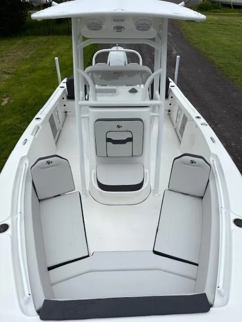 Slide: The Image of 2025 Sea Pro 225 Sandbar boat interior with seating and console, showcasing modern design. - 11