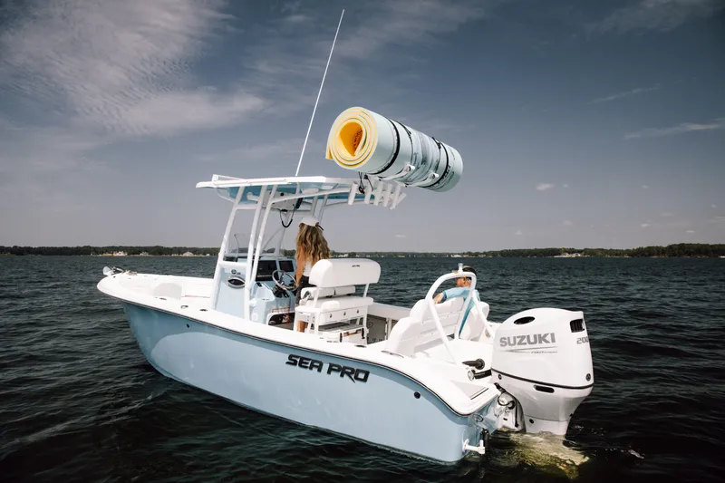 Slide: The Image of 2025 Sea Pro 225 Sandbar boat on water, featuring Suzuki outboard motor. - 17