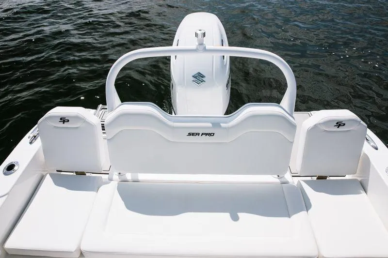 Slide: The Image of 2025 Sea Pro 225 Sandbar boat, rear view with seating and motor on water. - 18