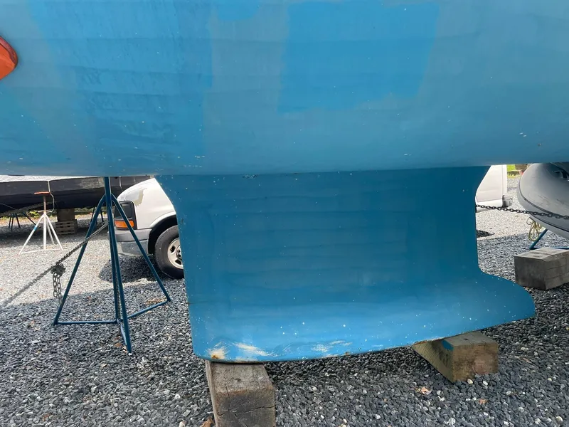 Slide: The Image of 2008 Jeanneau Sun Odyssey 45 DS sailboat keel on gravel, supported by blocks. - 25