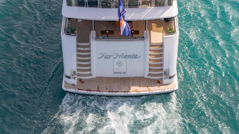 Slide: The Image of Westport 40M 2014 yacht cruising on turquoise waters, rear view. - 11