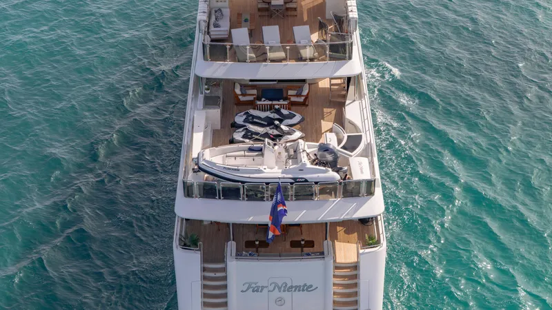 Slide: The Image of Luxurious 2014 Westport 40M yacht on turquoise waters, featuring spacious decks and elegant design. - 12