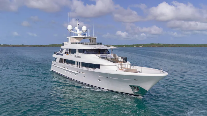 Slide: The Image of Luxurious 2014 Westport 40M yacht cruising on clear blue waters under a partly cloudy sky. - 15