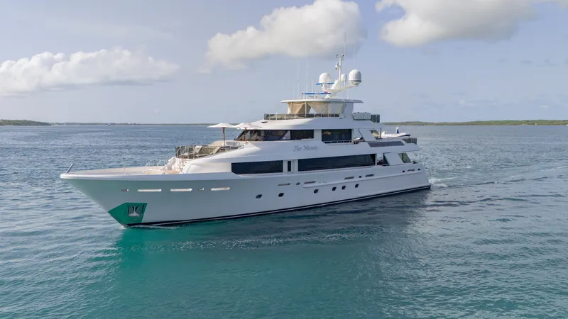 Slide: The Image of Luxurious 2014 Westport 40M yacht cruising on calm blue waters under a clear sky. - 16